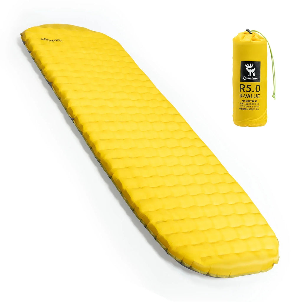 Yellow camping mattress with a carrying bag on a white background