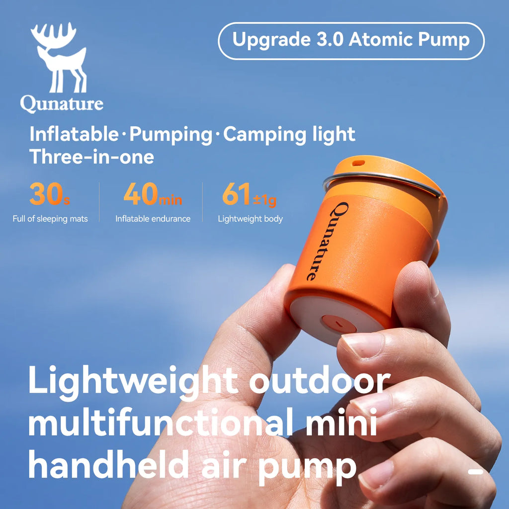 An ultra-light mini orange electric air pump is held in the hand