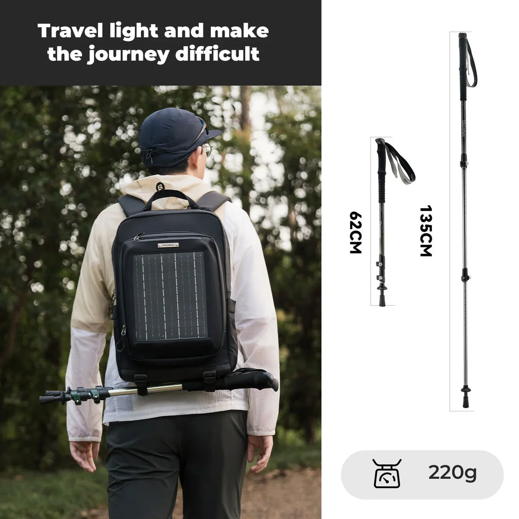 Person wearing a black backpack with solar panel, hiking pole, and measurement details on a white background.#color_black