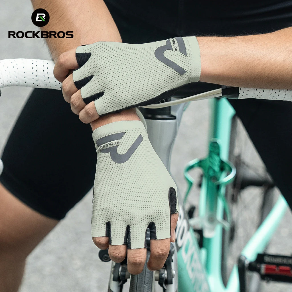 Person wearing cycling gloves holding a bike handlebar with 'RockBros'  branding. #color_Beige